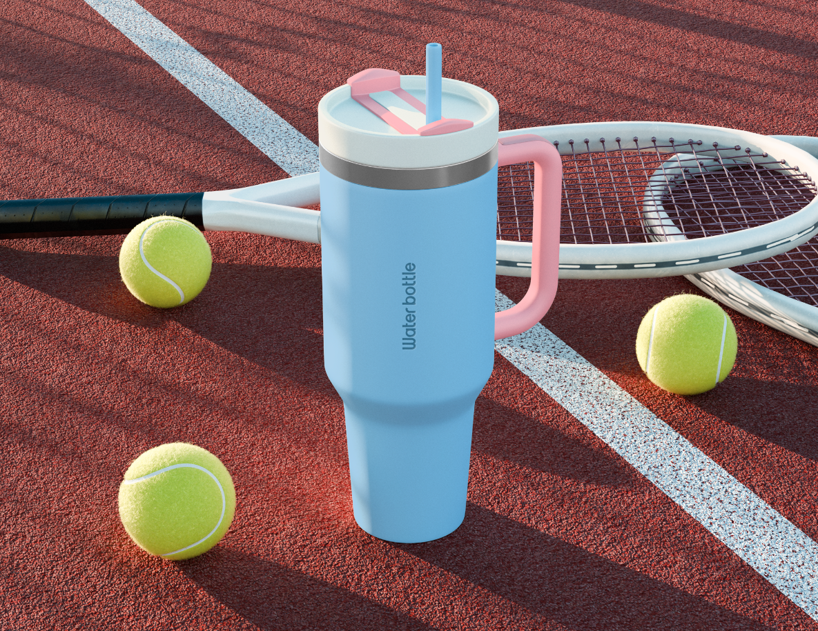 Blue water bottle with a pink handle on a tennis court.