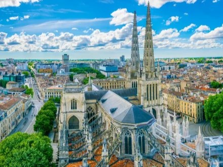 Aerial view of Bordeaux Cathedral under blue sky