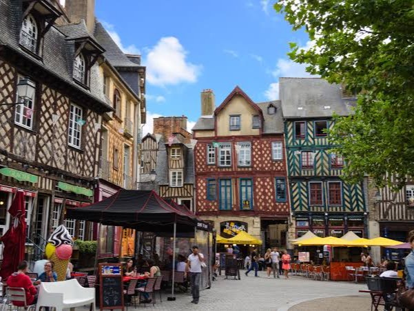 A street of shops with a variety of patrons