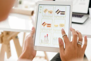 Person using tablet displaying CPG category products on screen.