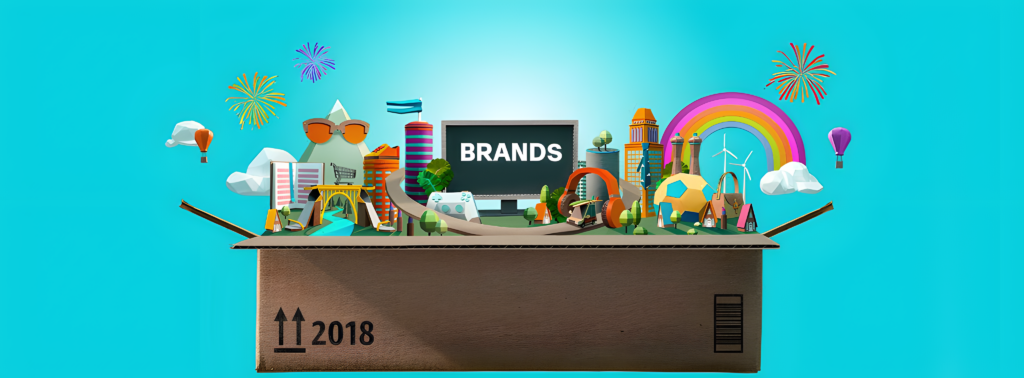 Cardboard box labeled 2018 opens to reveal diverse icons and objects, including a rainbow, buildings, and fireworks, with "BRANDS" on a blackboard.
