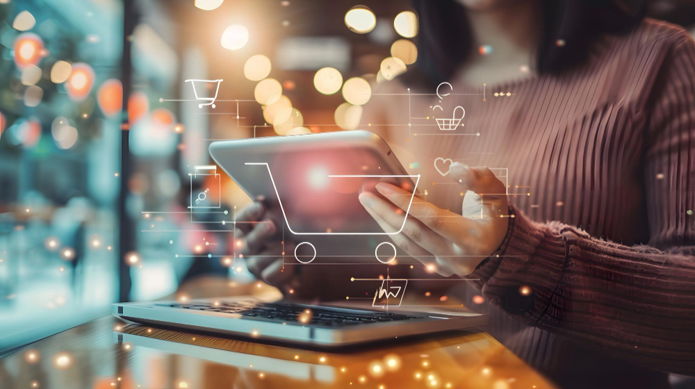 Woman analyzing B2B ecommerce data on tablet, icons overlaying image.